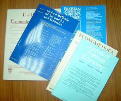 series of journal articles laying on desk